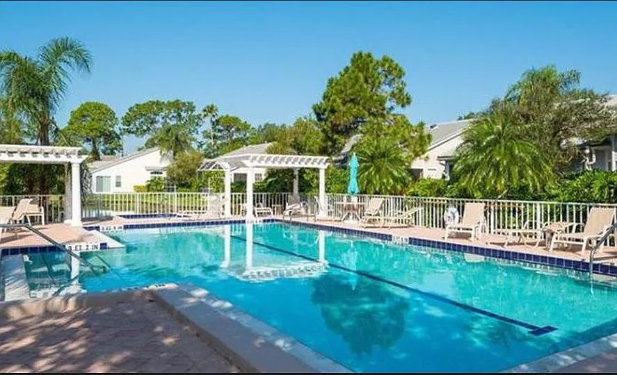 Heated community pool with Hot tub, bathrooms and outdoor shower. - 6313 Walton Heath Pl