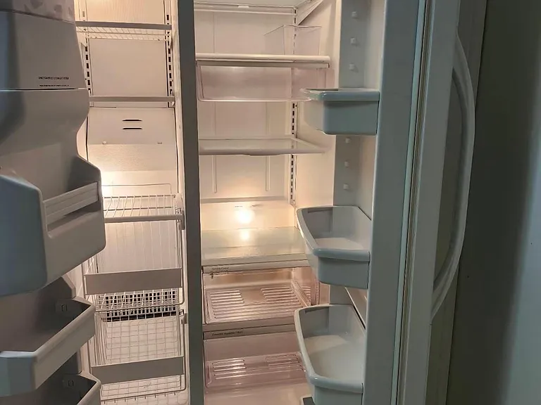 Refrigerator/Freezer with Ice/water Dispenser (vent cover IS included. Was off for cleaning)