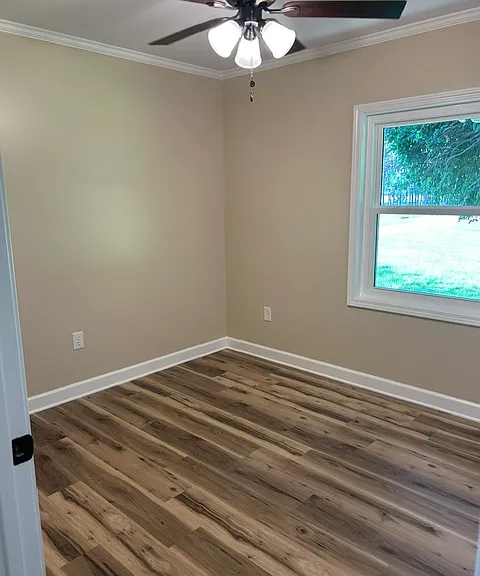 Bedroom #3 Ceiling fan. 36 inch door opening. Directly across the hall from bathroom which also has a 36 inch door for handicap accessibility.