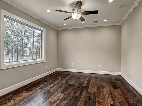 Living with huge picture window and hickory floors.