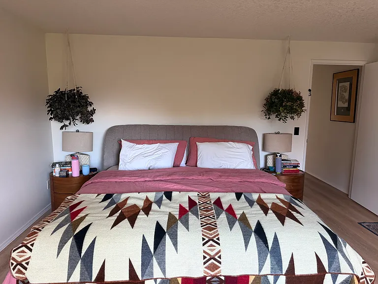 Extra-large primary bedroom with walk-in closet and territorial views