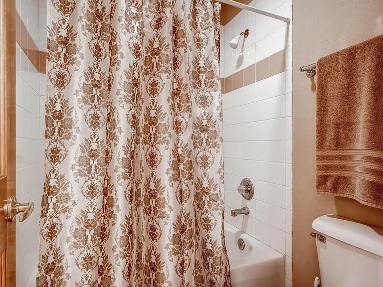 First floor bedroom with private vanity and bathroom