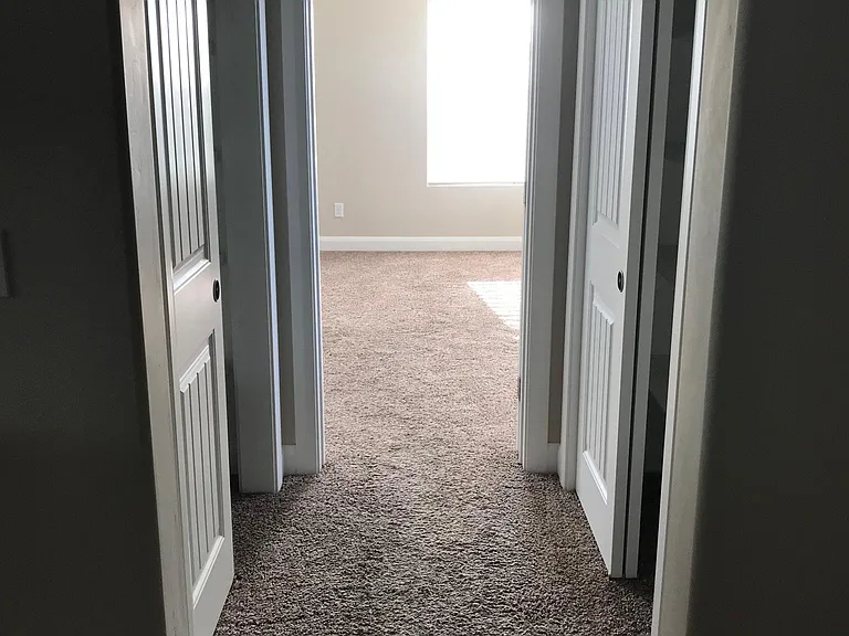 Two Linen Closet at Entry to Master