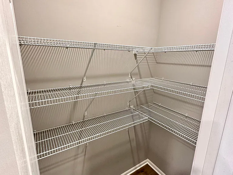 Large pantry across from kitchen and mud room