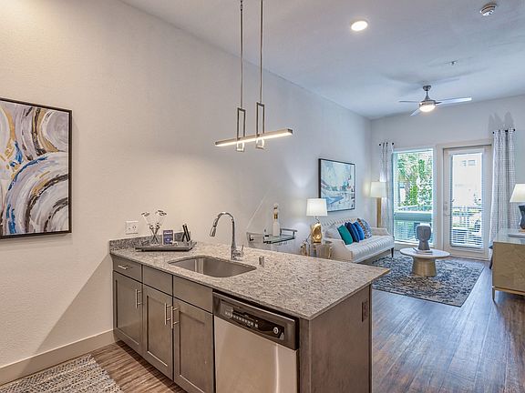 Open concept living at its best, with a seamless flow from the kitchen to the living room for easy entertaining.