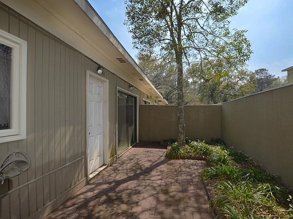 Front door, patio, privacy fence