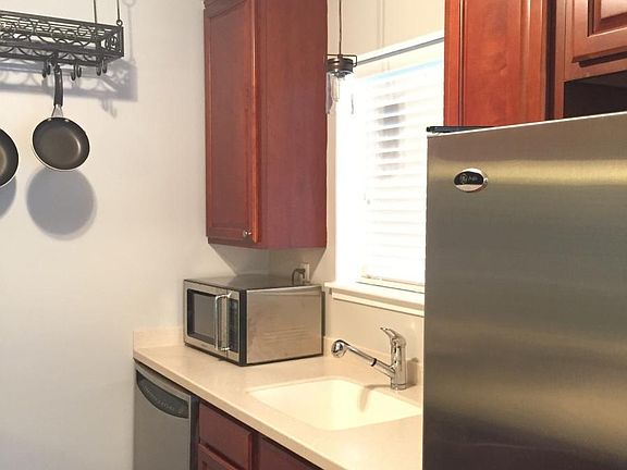 Cherry Cabinets, Corian Countertops, and Stainless Steel App