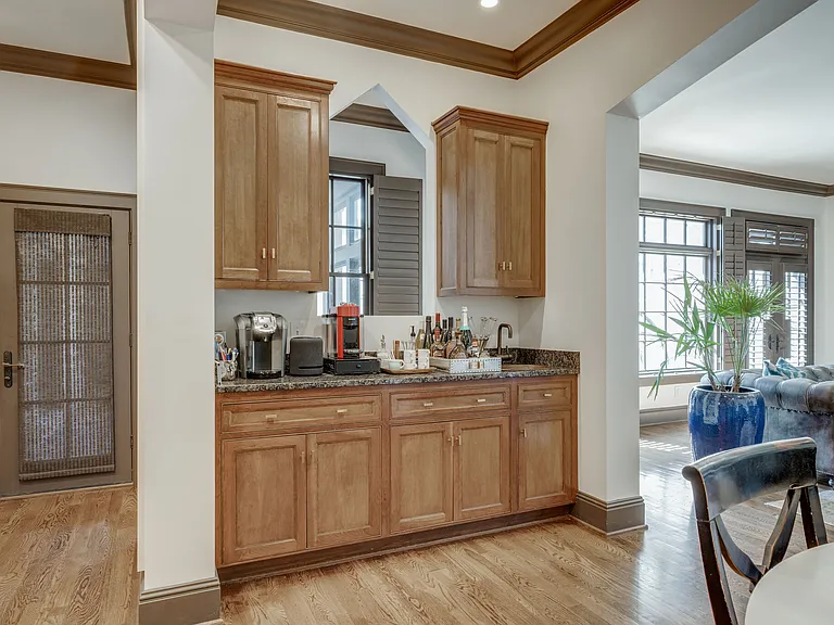 wet bar / coffee bar area with copper sink and additional storage