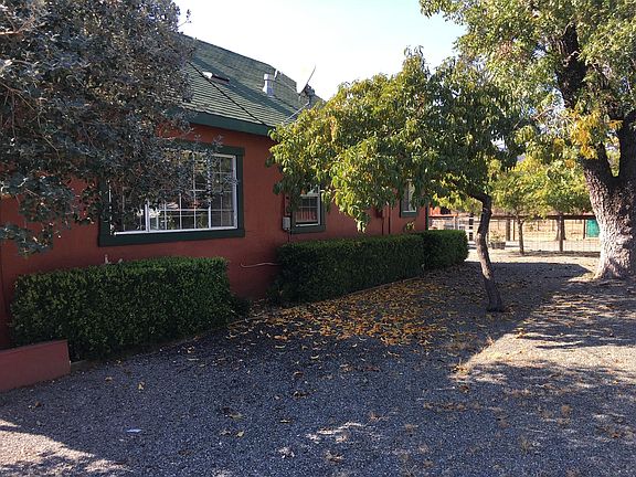 Yard adjacent to parking.