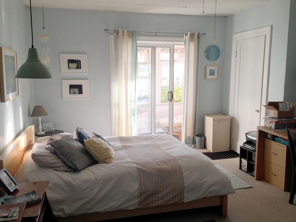 Bedroom with attached sunroom.
