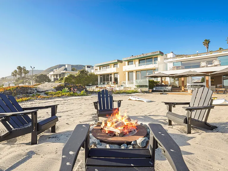 End your day fireside, just steps from the ocean.