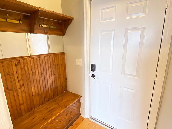 Entryway. Features built in mirror and storage