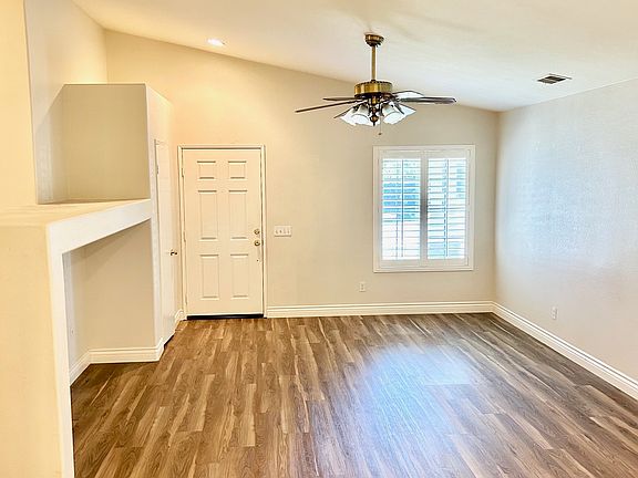 Living room with vaulted ceiling.