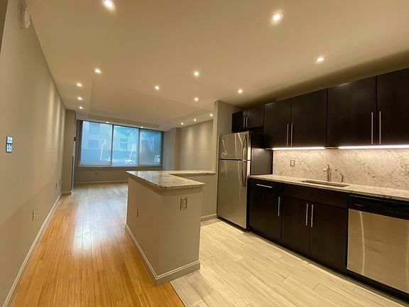 Bright large apartment with eco-friendly bamboo floor and designer kitchen, granite counters, stainless appliances, custom cabinets, ample closets and shelving.