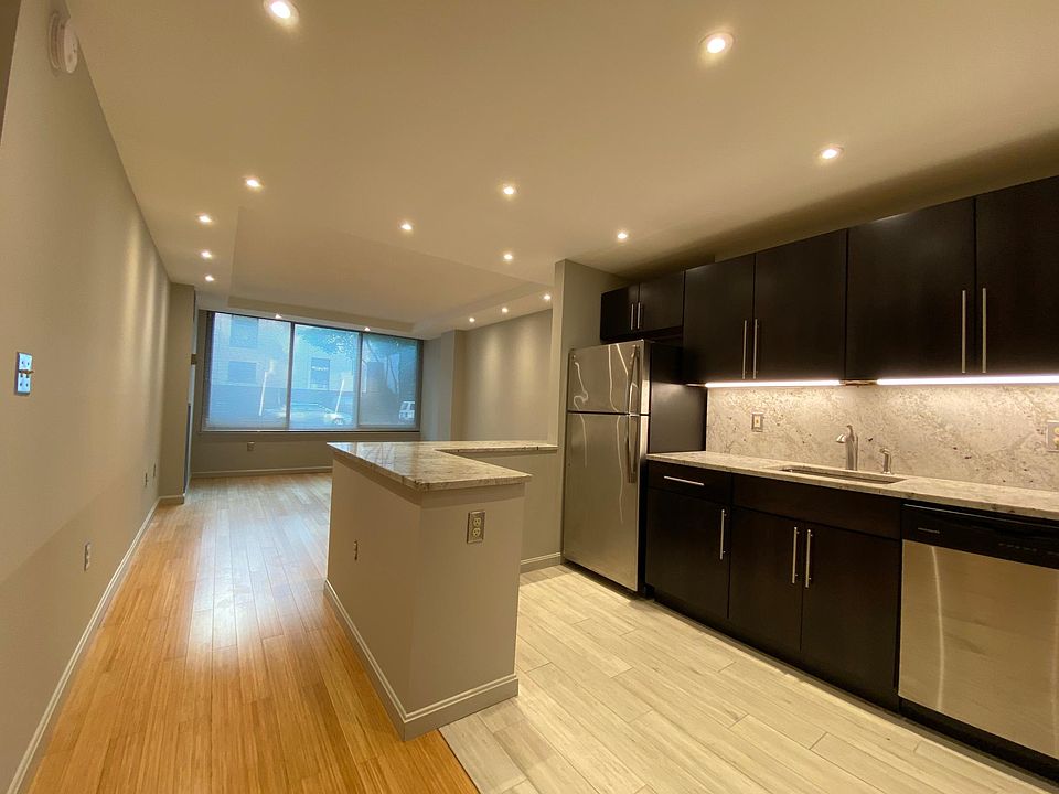 Bright large apartment with eco-friendly bamboo floor and designer kitchen, granite counters, stainless appliances, custom cabinets, ample closets and shelving.