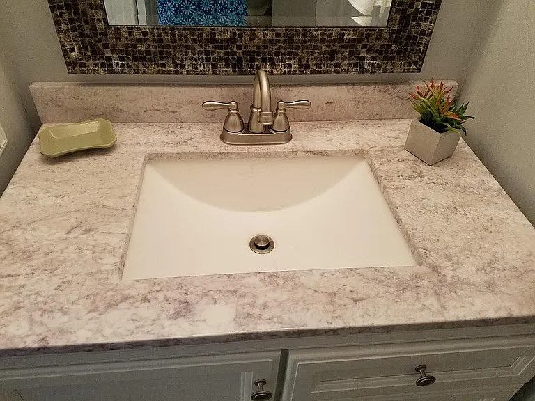 New faucet, lights, door frames and mirror.