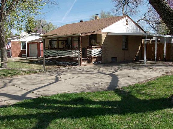 Covered front deck.  Carport and room to add garage