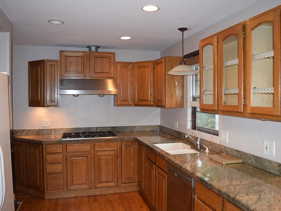 Galley kitchen with granite countertops and 5 burner gas coo