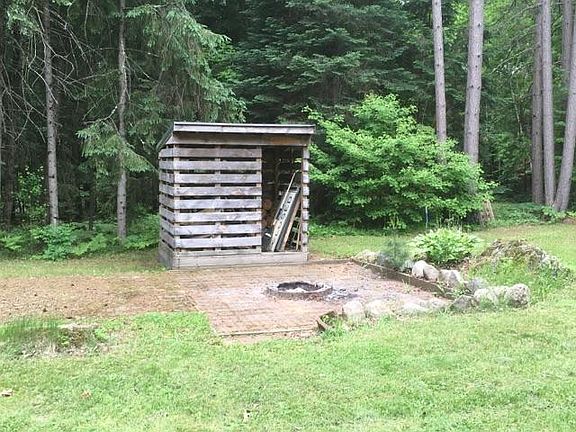 Fire pit and wood shed.
