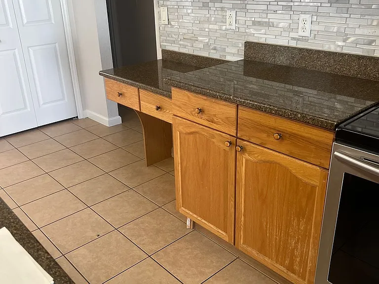 28 - Side kitchen view with extra counter space and built-in desk.