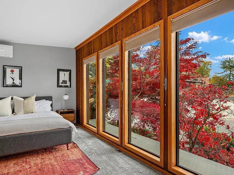 Primary bedroom view. Built in shades for privacy.