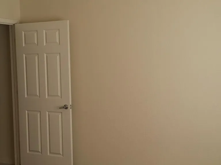 One of the 4 bedrooms with ceiling fan