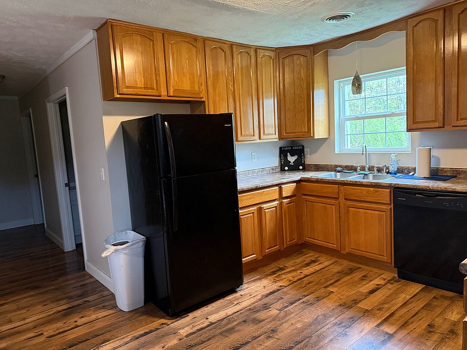 Kitchen with hallway to bathroom, laundry room and bedroom.