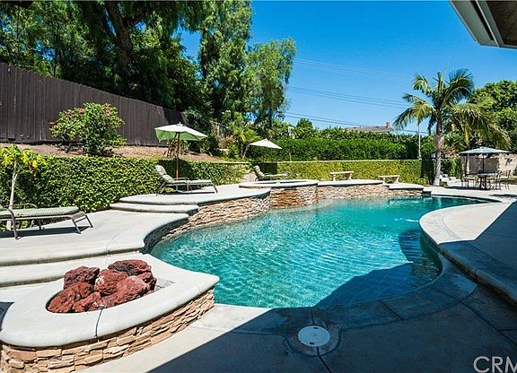 Cool down in the sparkling pool with pebble-tech finish, or relax in the raised spa after a long day.