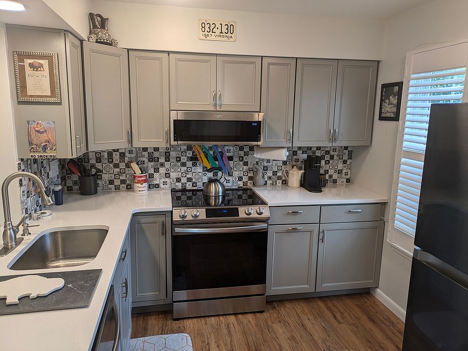 Completely renovated kitchen. Quartz countertop, brand new dishwasher, multi-function oven, microwave, and refrigerator.