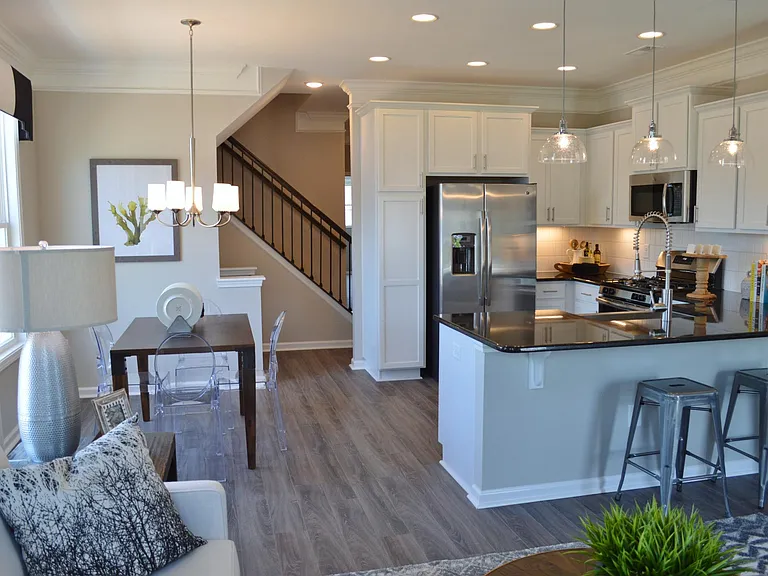 The kitchen has plenty of dining space in the breakfast nook as well as a breakfast bar at the counter.