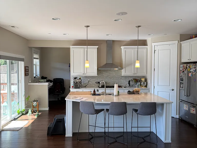 Garage door entry from behind the kitchen with shoe area