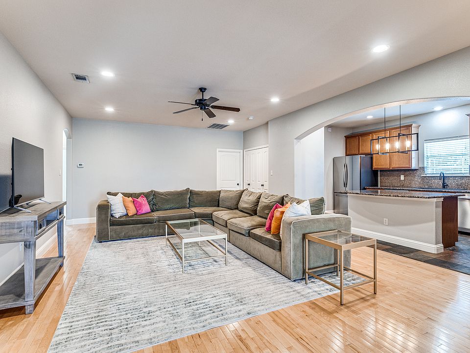 2700 Merida | Full frontal view of open-concept kitchen with island and stainless steel appliances.