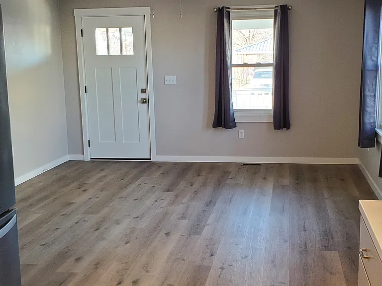Front Door in Living Room (from Kitchen)