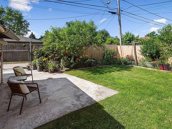 Private and peaceful, this back yard is a gardener's delight