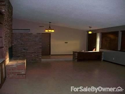 Living Room : New tile floors and wood blinds for windows.