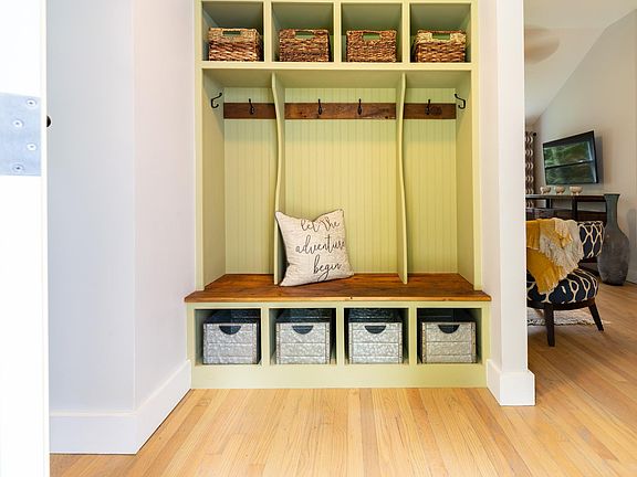 Beautiful custom built-in coat rack and storage unit.