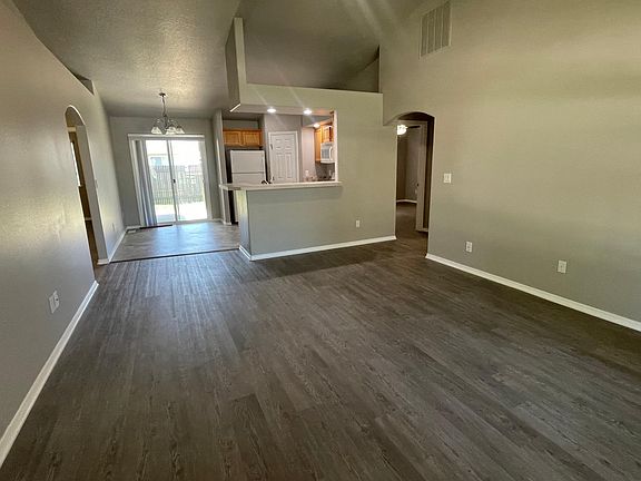 View from front door. The kitchen has space for an eat-in table and chairs, plus can put barstools up to peninsula.