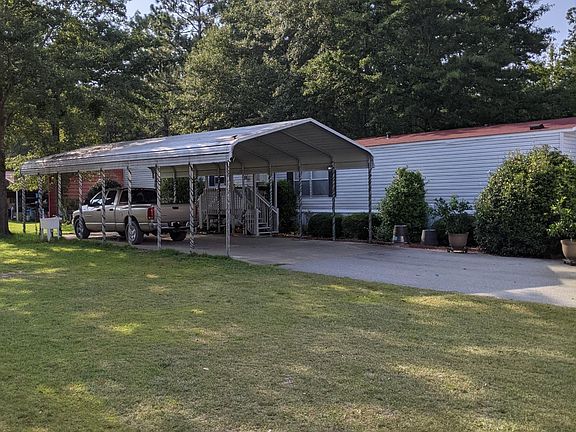 View of carport and home.