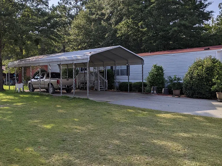 View of carport and home.
