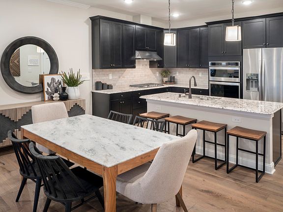 Open floor plan between the dining and kitchen area - Model Representation