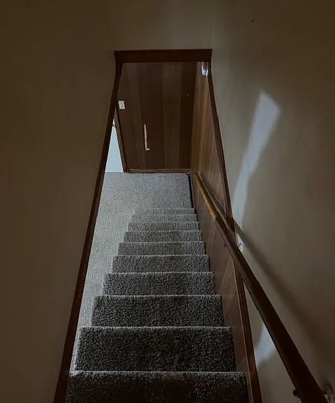 Stairs to Lower Level (across from hall bath)