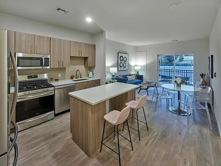 Experience modern living with this stylish open-plan kitchen and living area, perfect for entertaining.