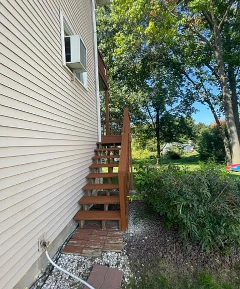 steps coming off back deck for easy exit with pets or beach access or visitors