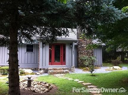 Exterior View with Japanese garden
						:
						huge covered porch in the back that leads to deck and stairs to the large creek