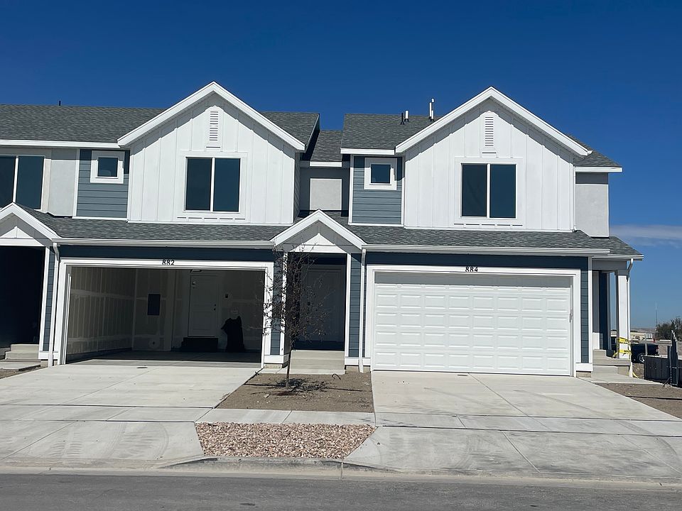 The unit on the left with the open garage door is the actual unit.