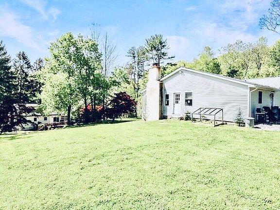 side of house with picture of yard