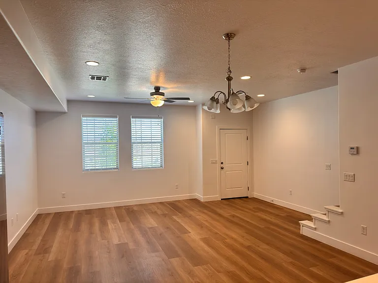 Living room with plenty of light and recessed lighting. Overhead fan for air movement.