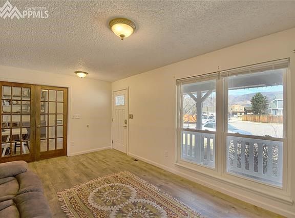 Formal living room has natural light