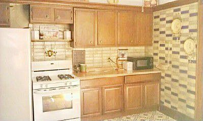 Kitchen with New Stainless side by side fridge, gas stove, new kitchen cabinet