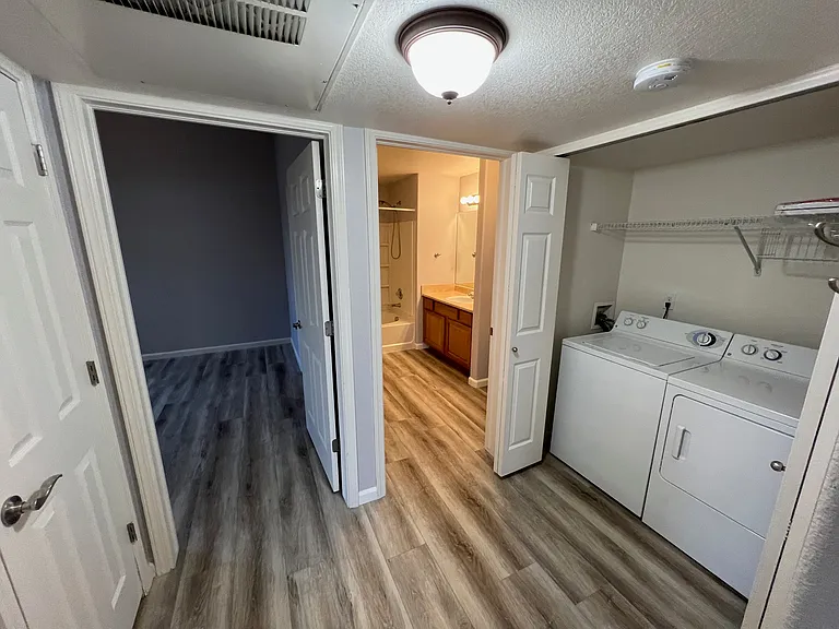Entrance to bedroom, bathroom and in unit washer & dryer.